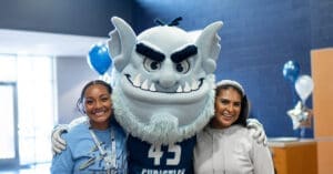 Troll with students at celebration, Trinity Together